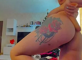 Tattooed webcam babe rams dildo in big natural tits ass action 🔥