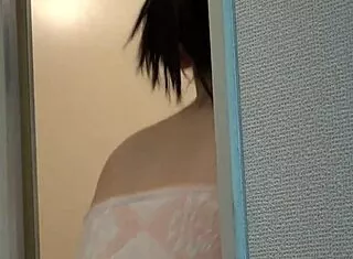Akari Minase carefully washes her body during a steamy shower session