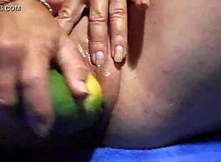 Gaping wet pussy with thick cucumber close-up