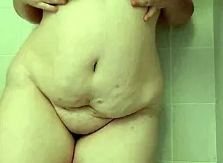 bbw brunette teases big tits and ass in homemade shower