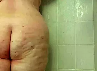 bbw brunette teases big tits and ass in homemade shower