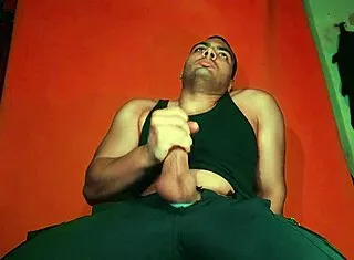 sexy chinese bodybuilder rubs spanish guitar on huge cock over carrot backdrop