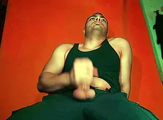 sexy chinese bodybuilder rubs spanish guitar on huge cock over carrot backdrop