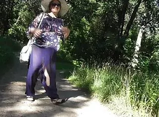 hairy chubby mature flashes beaver under skirt in park