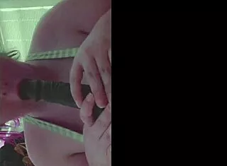 dildo slides between those huge tits nicely