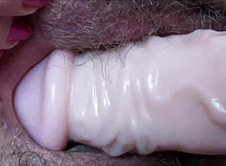 How deep can this huge dildo stretch her dripping wet pussy hole?