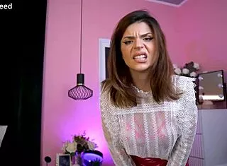 Boss goddess dominates with tattooed body in close-up femdom humiliation tease.