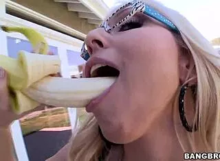 Blonde bimbo teases big tits with banana