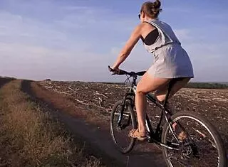 Cycling slut flashes miniskirt ass outdoors