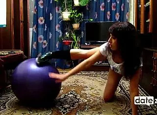 naked brunette hottie grinds exercise ball to sweaty climax.