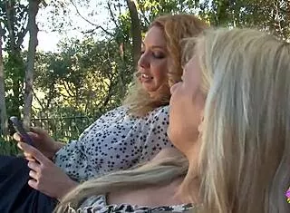 Lesbian milf Kiki Daire bangs Alessandra Noir's tight pussy outdoors despite taboo