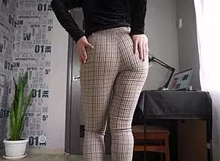 office coworker flashes her tight milf ass in pants...