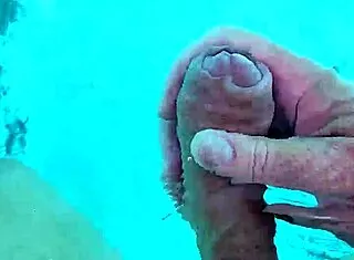 guy jerks cock naked poolside solo fun