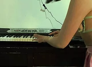 wanna see this cute 18+ babe in pink skirt get her tight pussy fucked while trying to play piano?