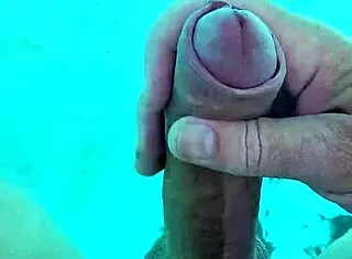 guy jerks cock naked poolside solo fun