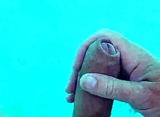 guy jerks cock naked poolside solo fun