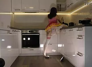 Hottest Redhead Tattooed Cheerleader Flashes See-Through Panties In Kitchen