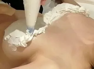 Homemade amateur tapes cream-covered bra hugging busty girlfriend's huge tits in bedroom