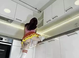 Hottest Redhead Tattooed Cheerleader Flashes See-Through Panties In Kitchen