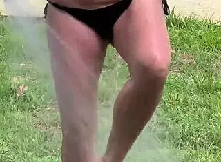 Farmers submissive wifey pisses on saggy plump tits outside