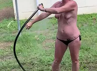 Farmers submissive wifey pisses on saggy plump tits outside