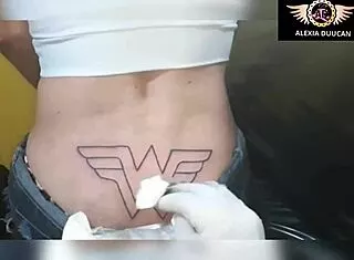 Tattoo Artist Inks Model's Tight Rear in Best Moments