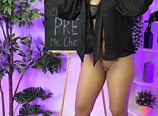Look at this sexy milf sliding into her tight leather harness suit slowly