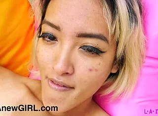 gorgeous asian model strips naked sofa closeup photoshoot
