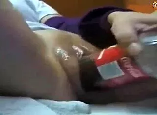 hot teen shoves cola bottle deep in shaved pussy