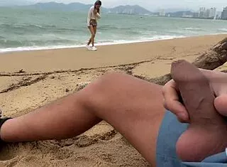 Public Dick Flasher Helps Skinny Brunette Cum On Beach!
