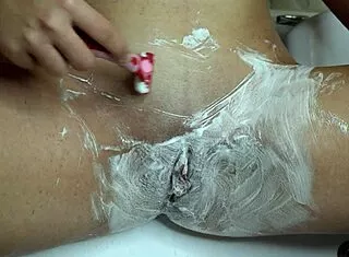 wanna watch this closeup pussy shave with trimmer and razor in the shower?