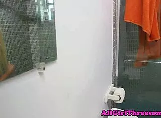 busty pierced babes dive into wet pussies under steamy shower