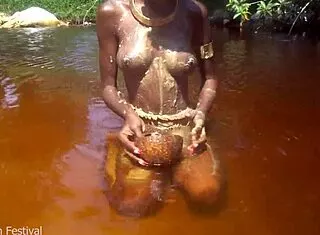 skinny tribe slut bares tits outdoors at beach
