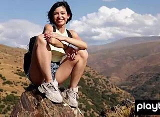 petite latina sophia strips naked posing high on mountain peak