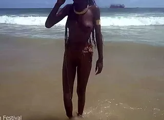skinny tribe slut bares tits outdoors at beach