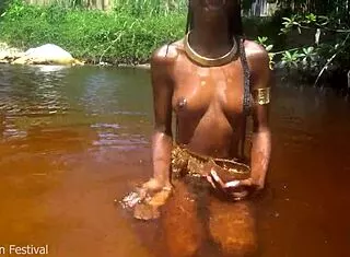 skinny tribe slut bares tits outdoors at beach