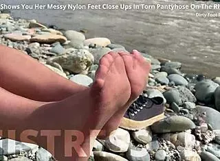 Goddess Dips Messy Barefoot Toes In Torn Pantyhose By River For Close-Ups