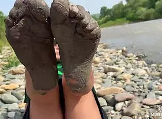 Goddess Dips Messy Barefoot Toes In Torn Pantyhose By River For Close-Ups