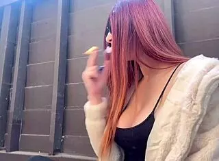 Artemisia Love smokes seductively outdoors in solo tease