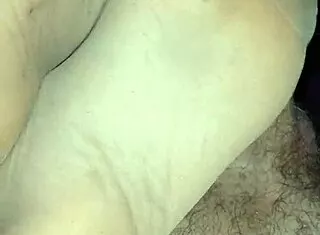 girlfriend gives teasing footjob in homemade tan nylon stockings