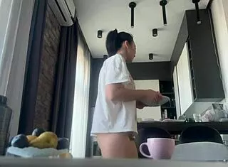 sexy big ass brunette housework flashing shaved pussy nude