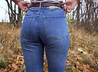 milf shakes amazing ass in tight blue jeans outdoors