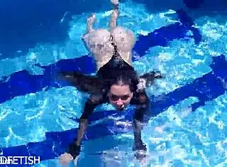 Jessica Bunny's latex body submerged, ready to submit underwater...