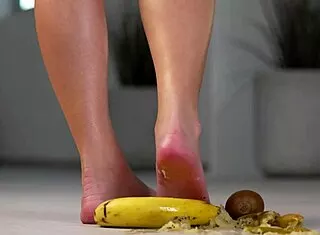 petite brunette crushes fruits under high heels in steamy foot fetish tease