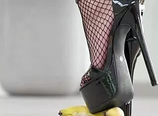 petite brunette crushes fruits under high heels in steamy foot fetish tease
