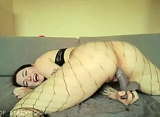 brunette tight pussy rides huge dildo fishnets ass-to-cam