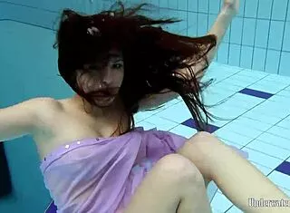 Aneta’s Big Tits Shine in Purple Pool Dress