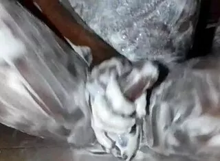 african dude slathers lotion over monster black cock and fat ass solo in bedroom stroking hard
