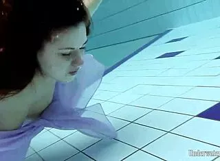 Aneta’s Big Tits Shine in Purple Pool Dress
