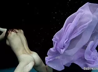 Aneta’s Big Tits Shine in Purple Pool Dress